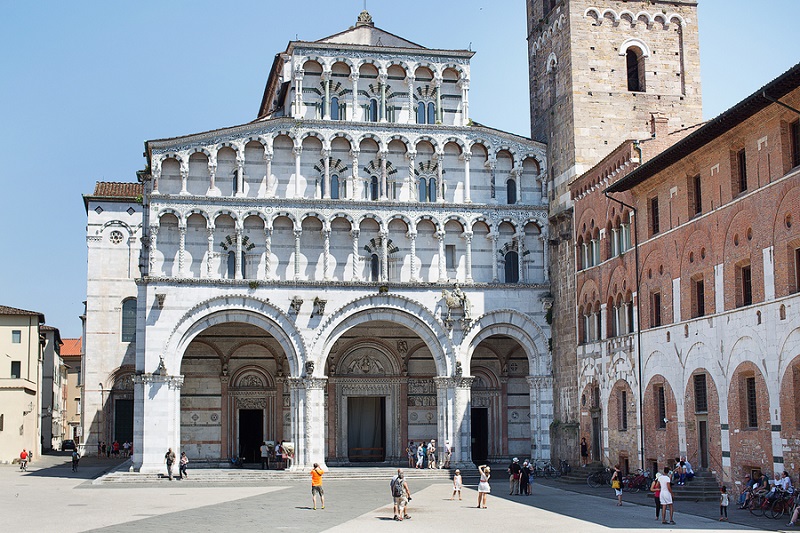 Lucca Italy-June 6 2015.Tourists on the forecourt of Lucca Cathedral (Duomo di Lucca Cattedrale di San Martino) is a Roman Catholic cathedral dedicated to Saint Martin in Lucca Italy. It is the seat of the Archbishop of Lucca.