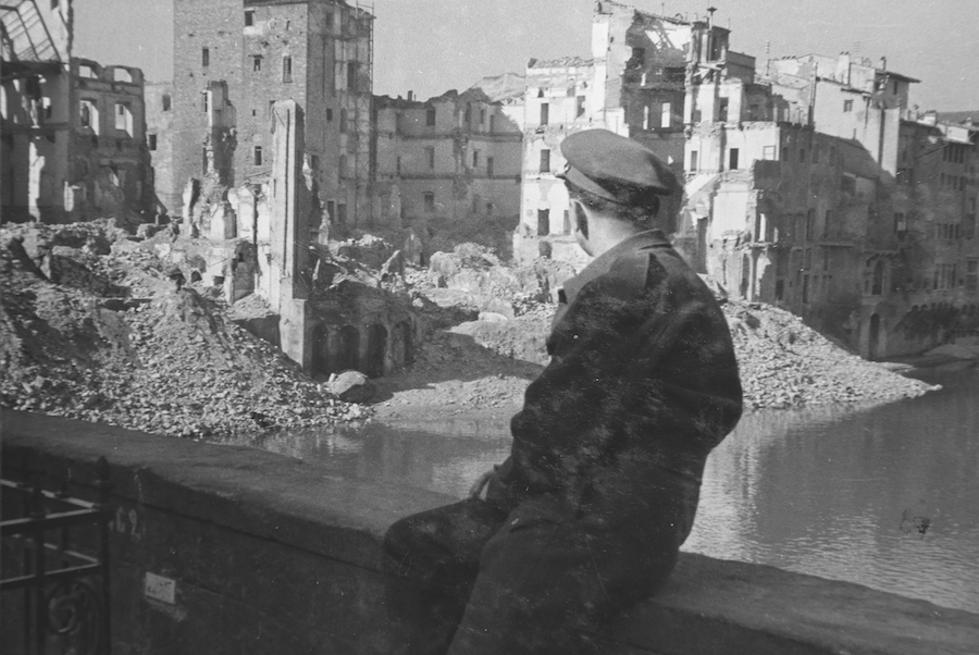 Man looking at the destruction from tiger Ponte Vecchio in 1945, photo credit: afs.org. 